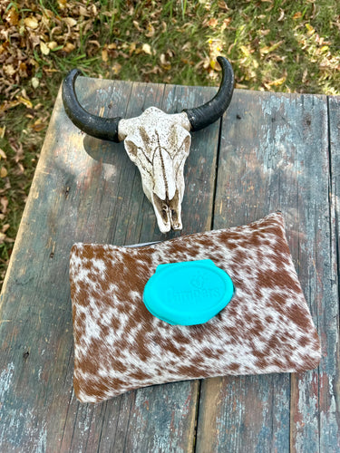 Brown and white speckled hair on hide baby wipes case