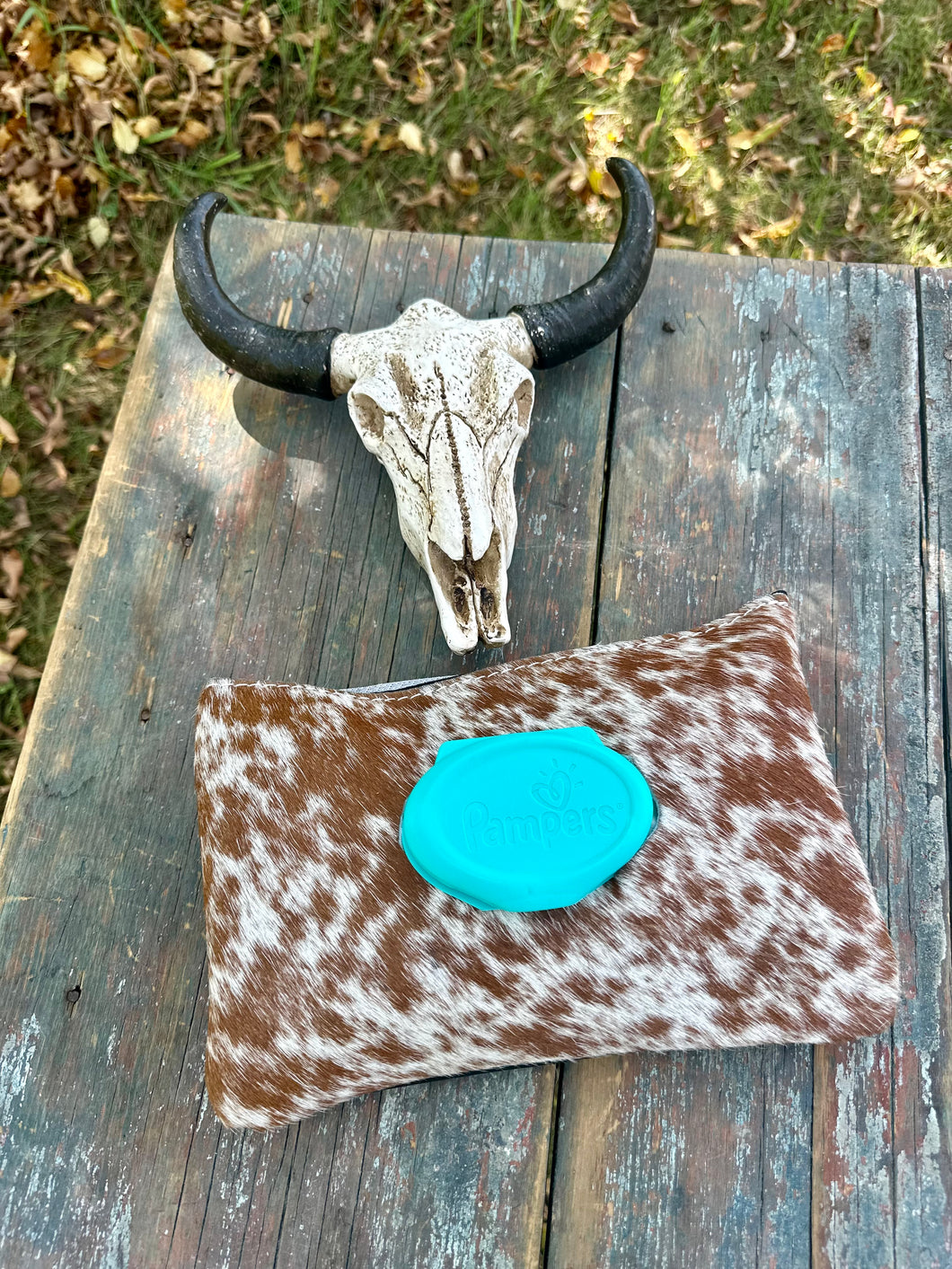 Brown and white speckled hair on hide baby wipes case