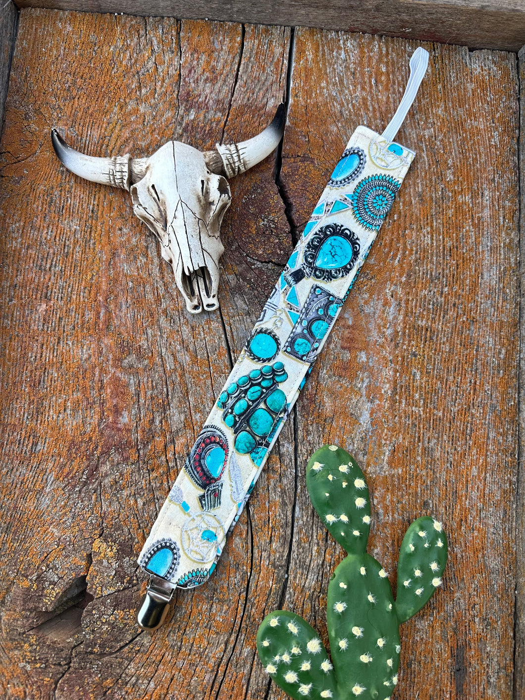 Turquoise loving cowkid pacifier clip
