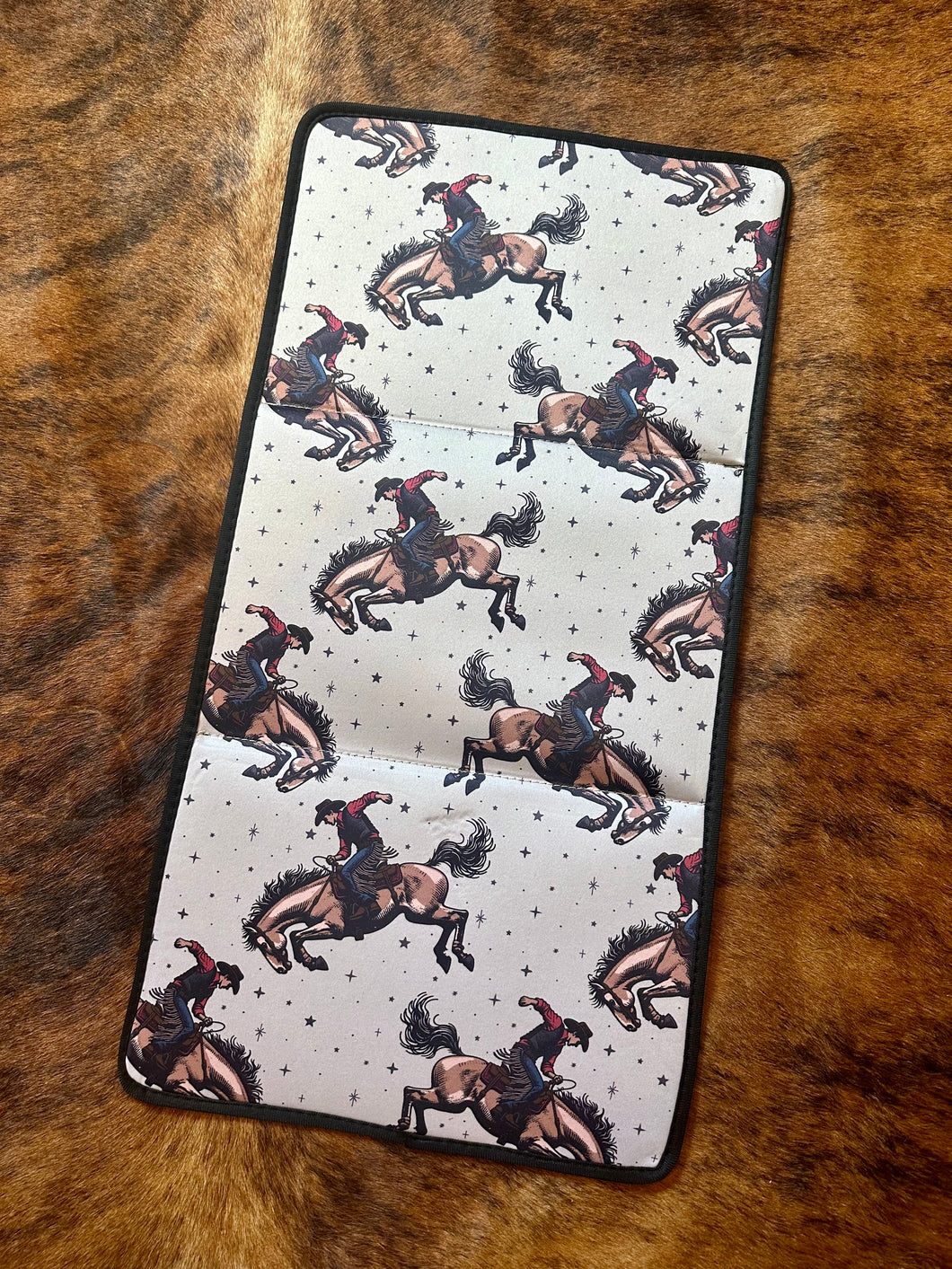 Bronc rider baby changing pad