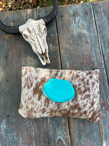 Brown and white speckled hair on hide baby wipes case