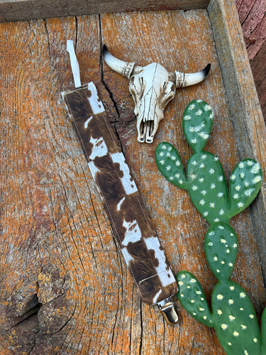 Brown and white cowprint pacifier clip