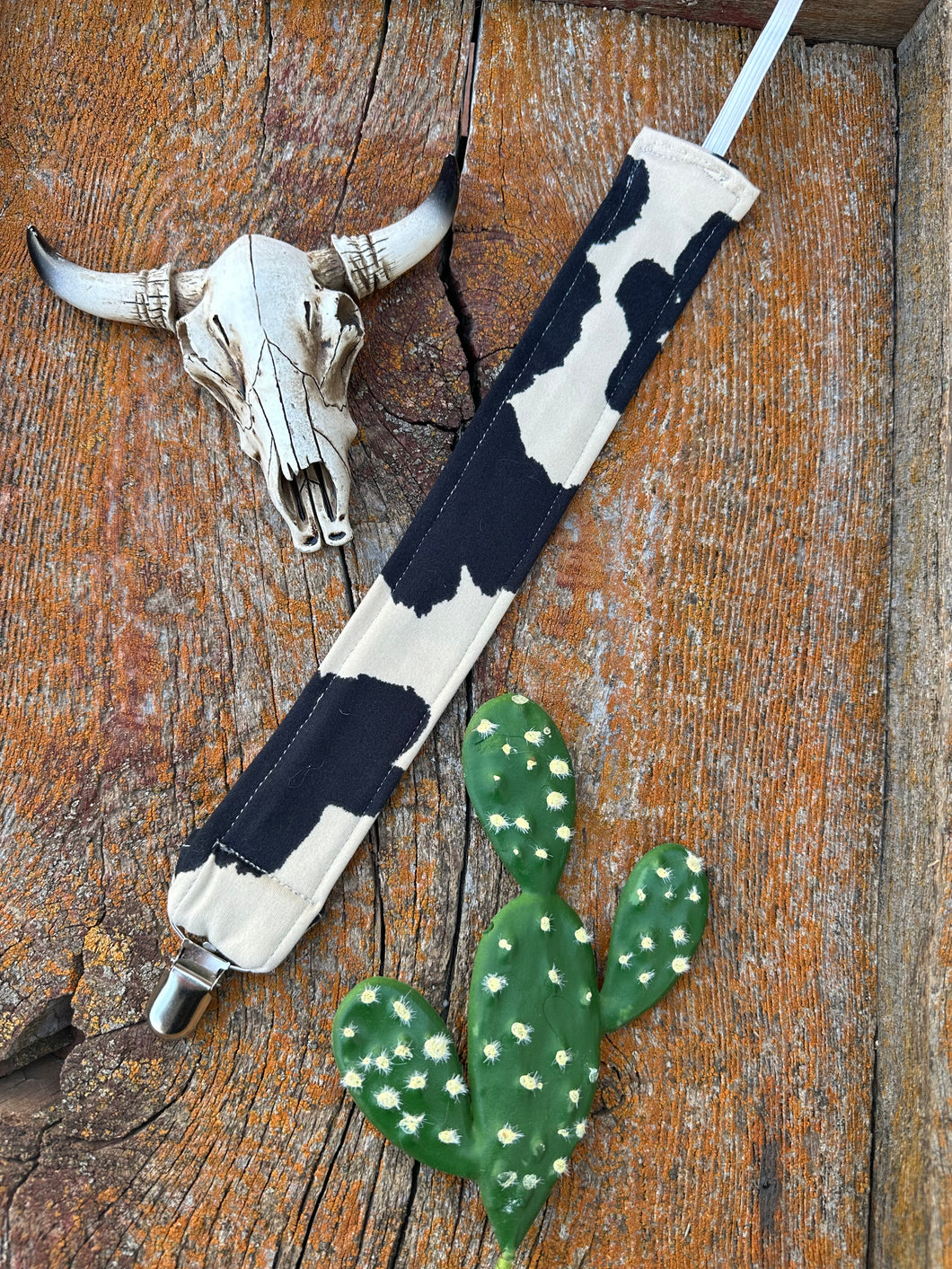 Black and white cowprint baby pacifier clip