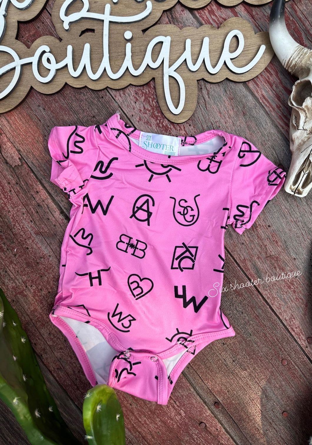 Pink brands baby onesie