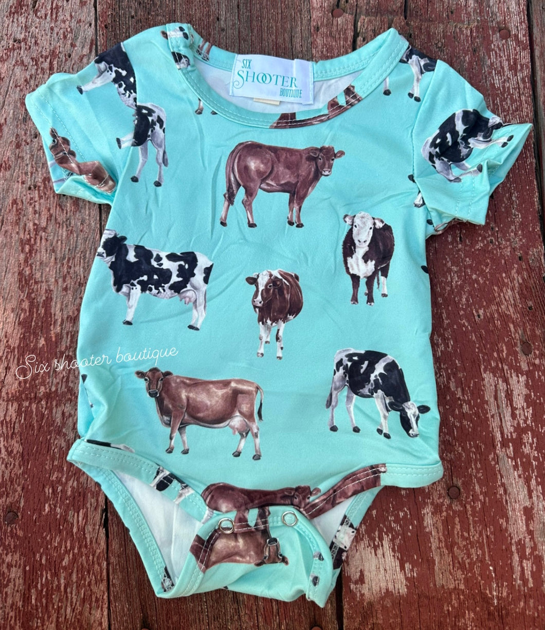 Turquoise cow baby onesie