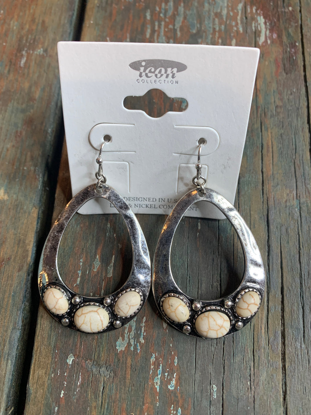White and silver earrings